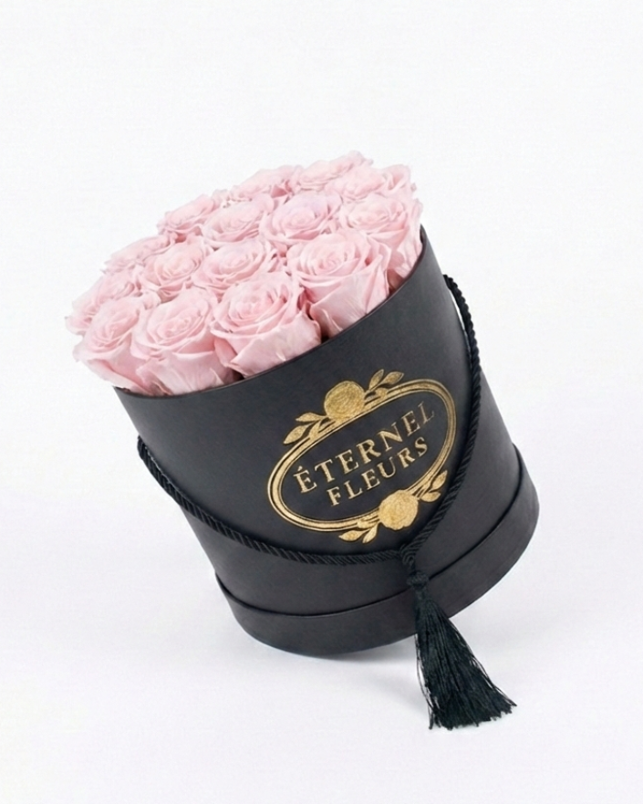 Black box with pink roses and 'Eternel Fleurs' branding on a white background