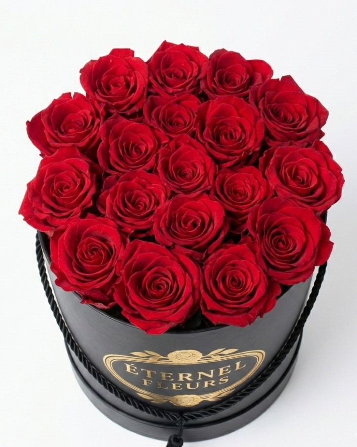 Black round box with red roses and 'Eternal Fleurs' branding on a white background