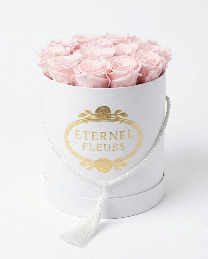 White round box with pink roses and 'Eternal Fleurs' branding on a white background